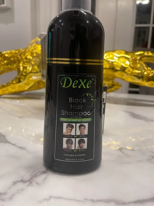 Bouteille de Dexe Black Hair Shampoo, avec texte descriptif et logo de la marque.